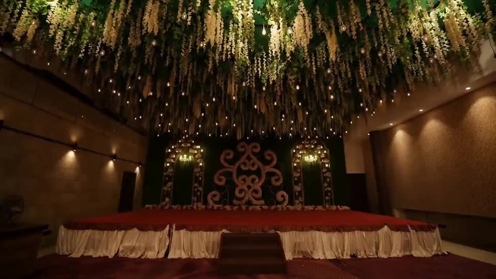 Mandap stage with red-carpet aisle at Bika Golaghata, Kolkata